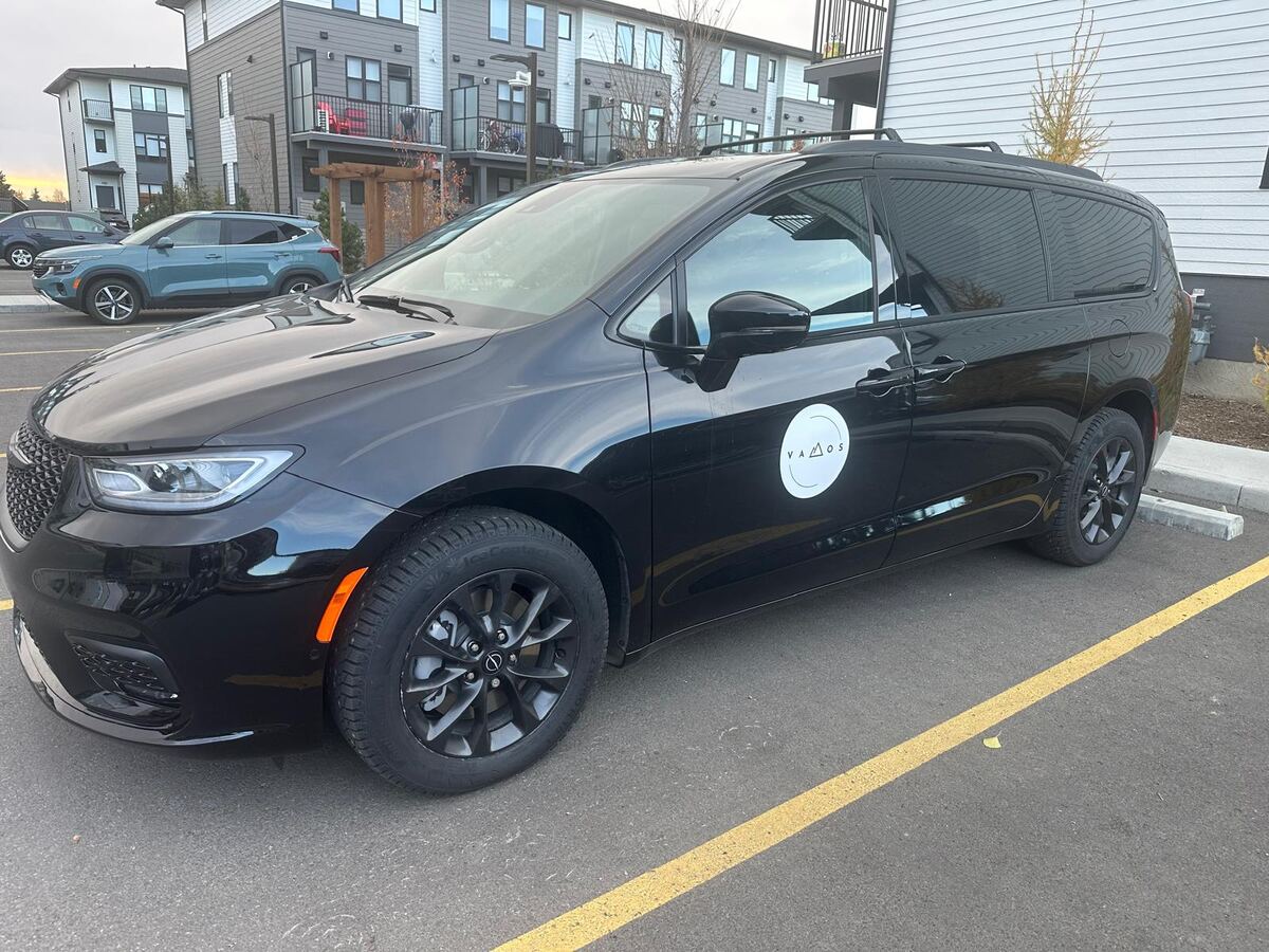 Vamos Express Calgary airport shuttle — black Chrysler Pacifica minivan